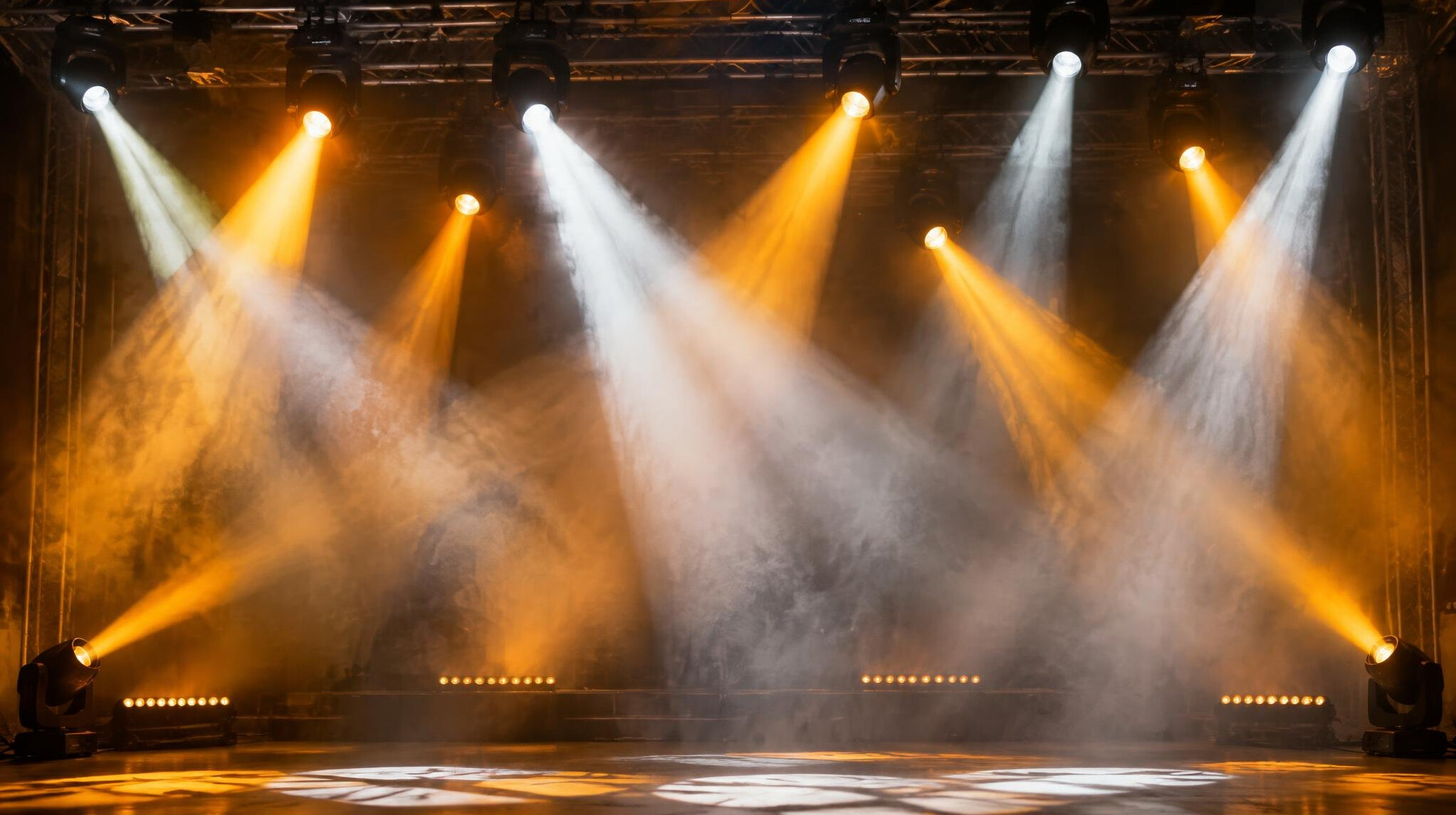 Stage lighting beams over a performance